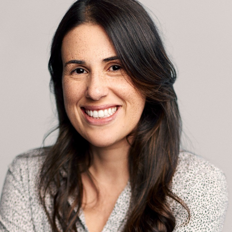 Professional headshot photograph of Ari Magalhaes