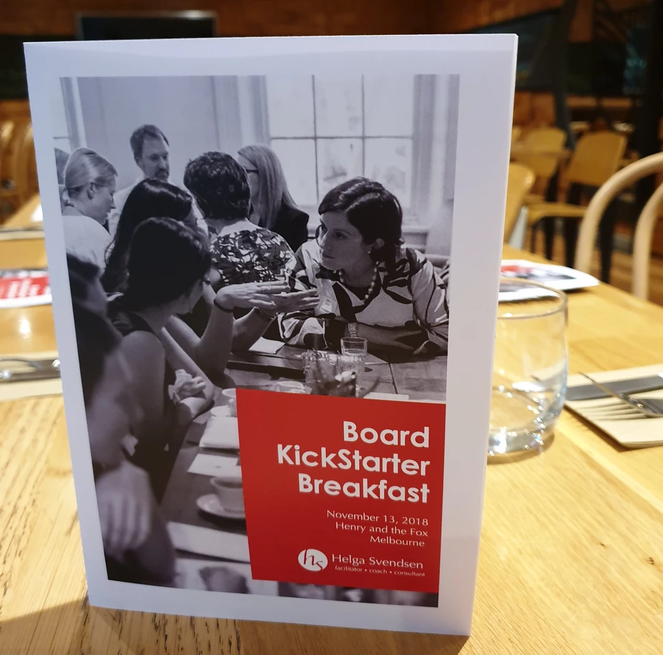 The November Take on Board breakfast information booklet stands on top an empty breakfast table.