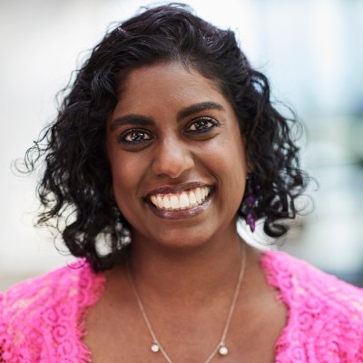 Professional headshot photograph of Malini Raj.
