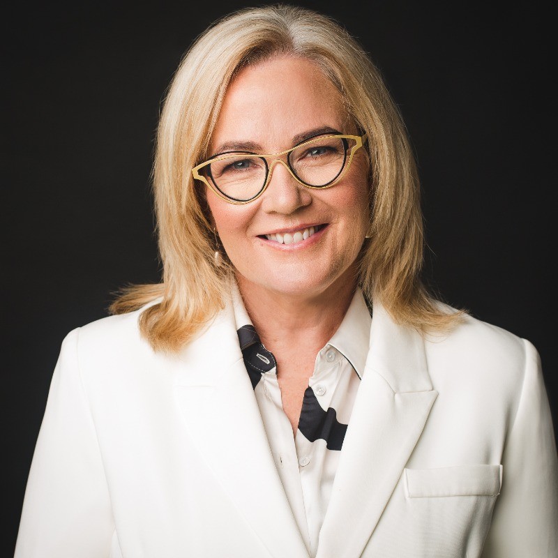 Professional headshot photograph of Moira Junge.